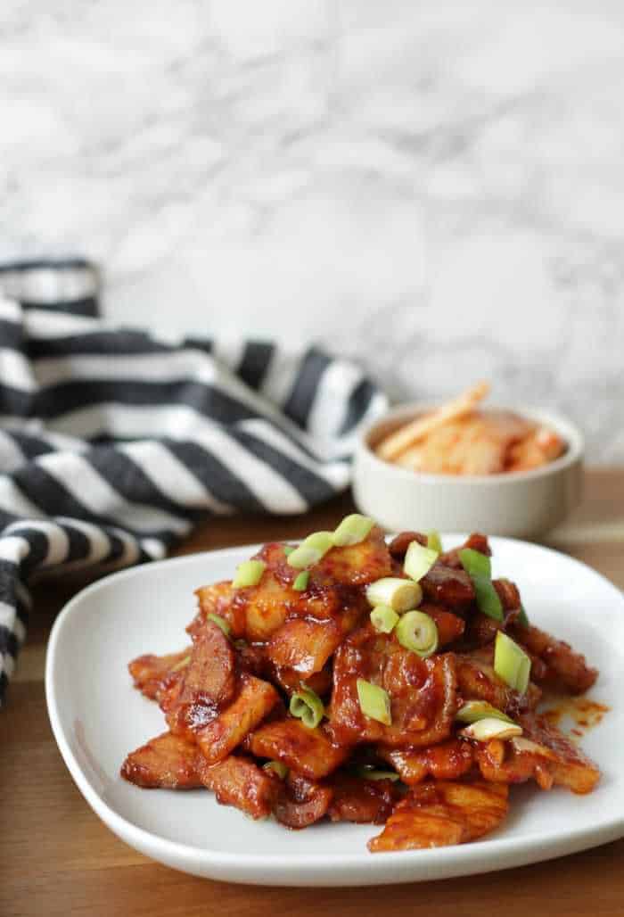 Close up of pork belly on a white plate