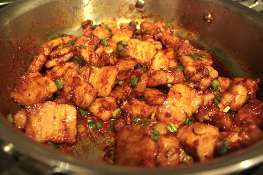 Stir fry of spicy pork belly and green onions