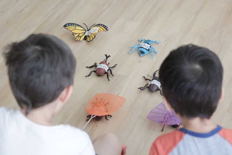 Two boys playing a bug reading game