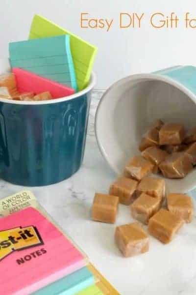 Two mugs filled with candy and Post-its