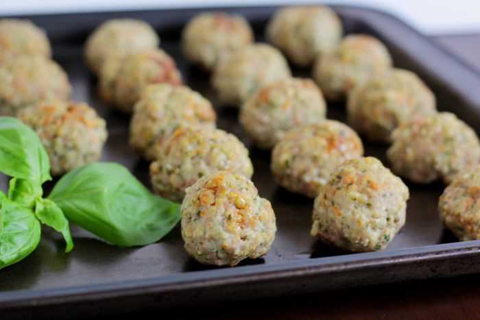 Kid friendly meatballs on a cookie sheet