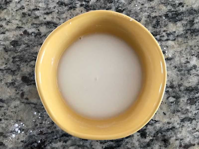Rice flour and water in a yellow bowl