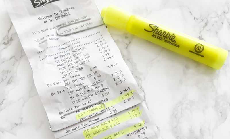 A receipt on a table with yellow highlighter