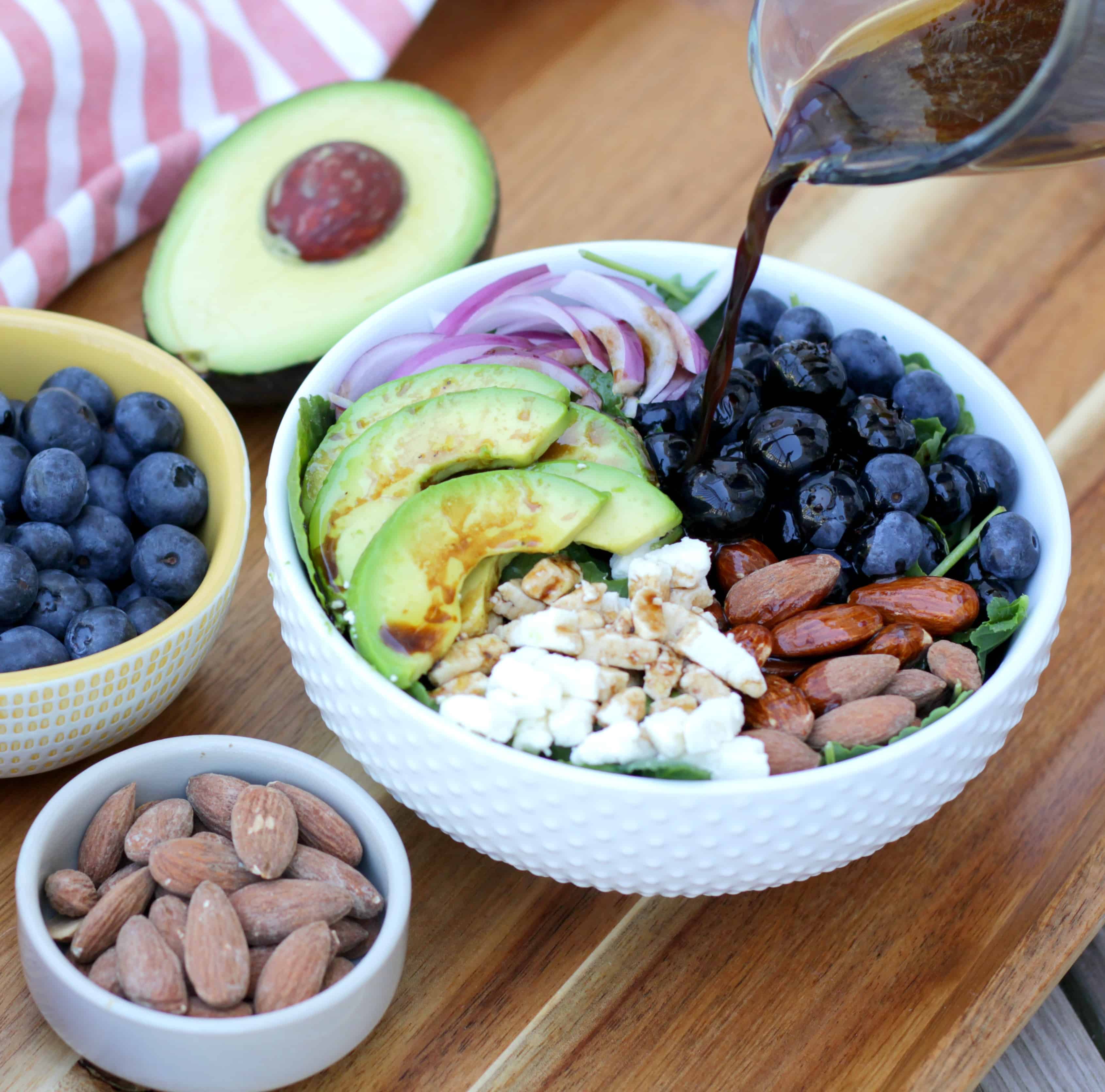 A blueberry salad with avocado and feta cheese