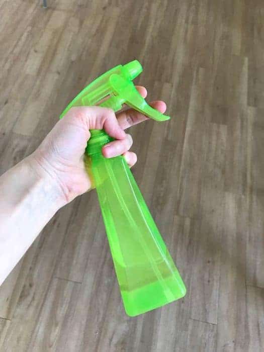 A spray bottle with vinegar-water solution inside