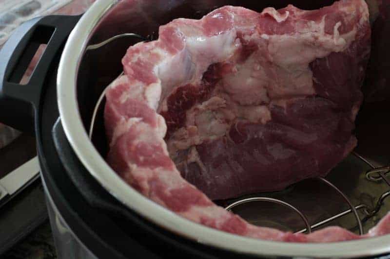 A picture of ribs curled up inside Instant Pot