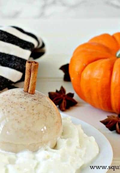 A pumpkin spice latte dessert with pumpkins