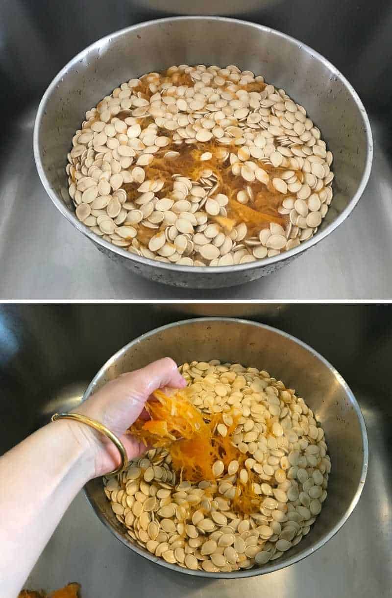 A hand cleaning pumpkin seeds