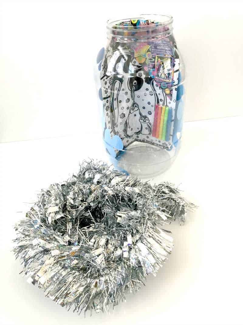 Filling container with tinsel