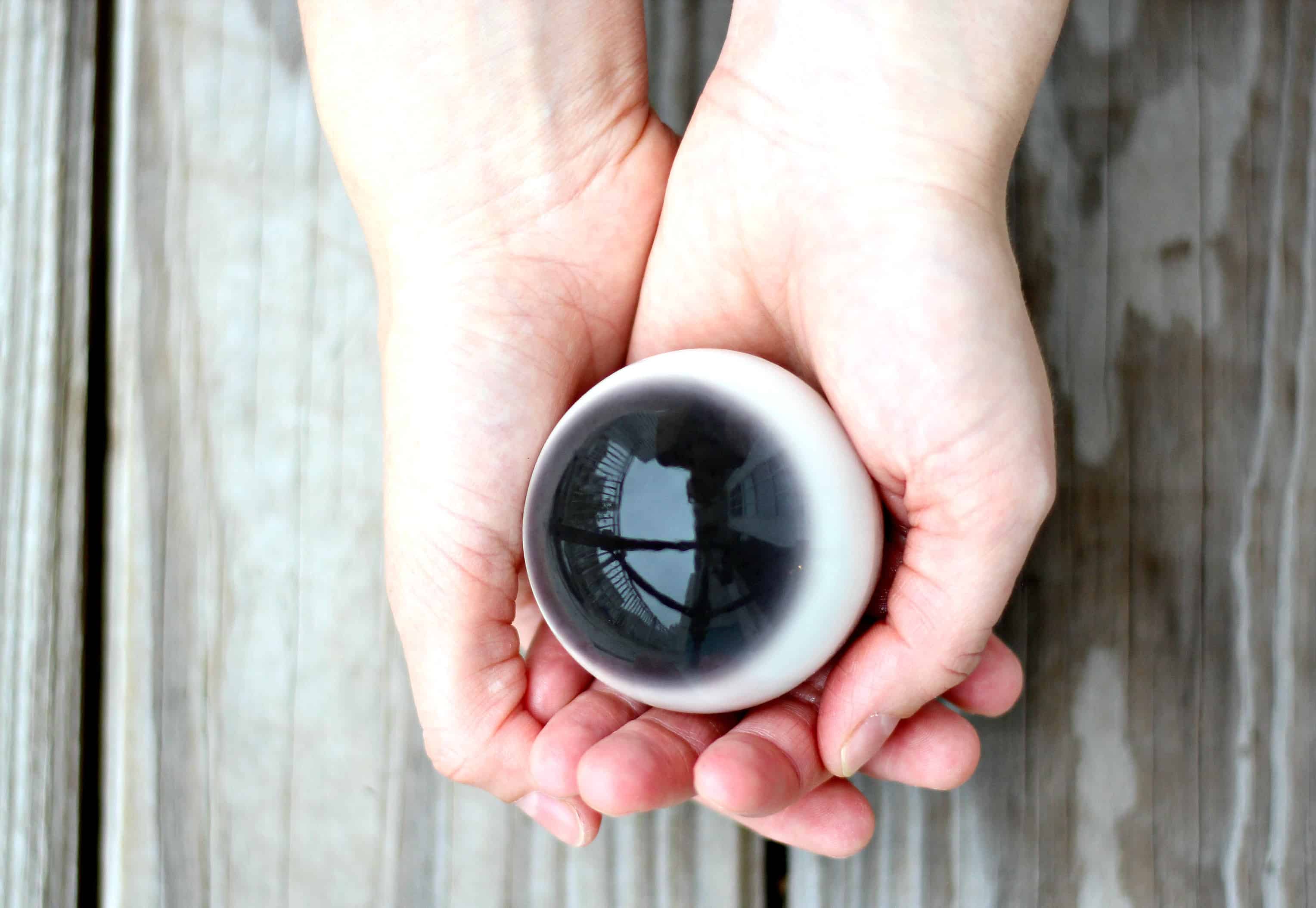 Edible eyeball held in hands of a woman