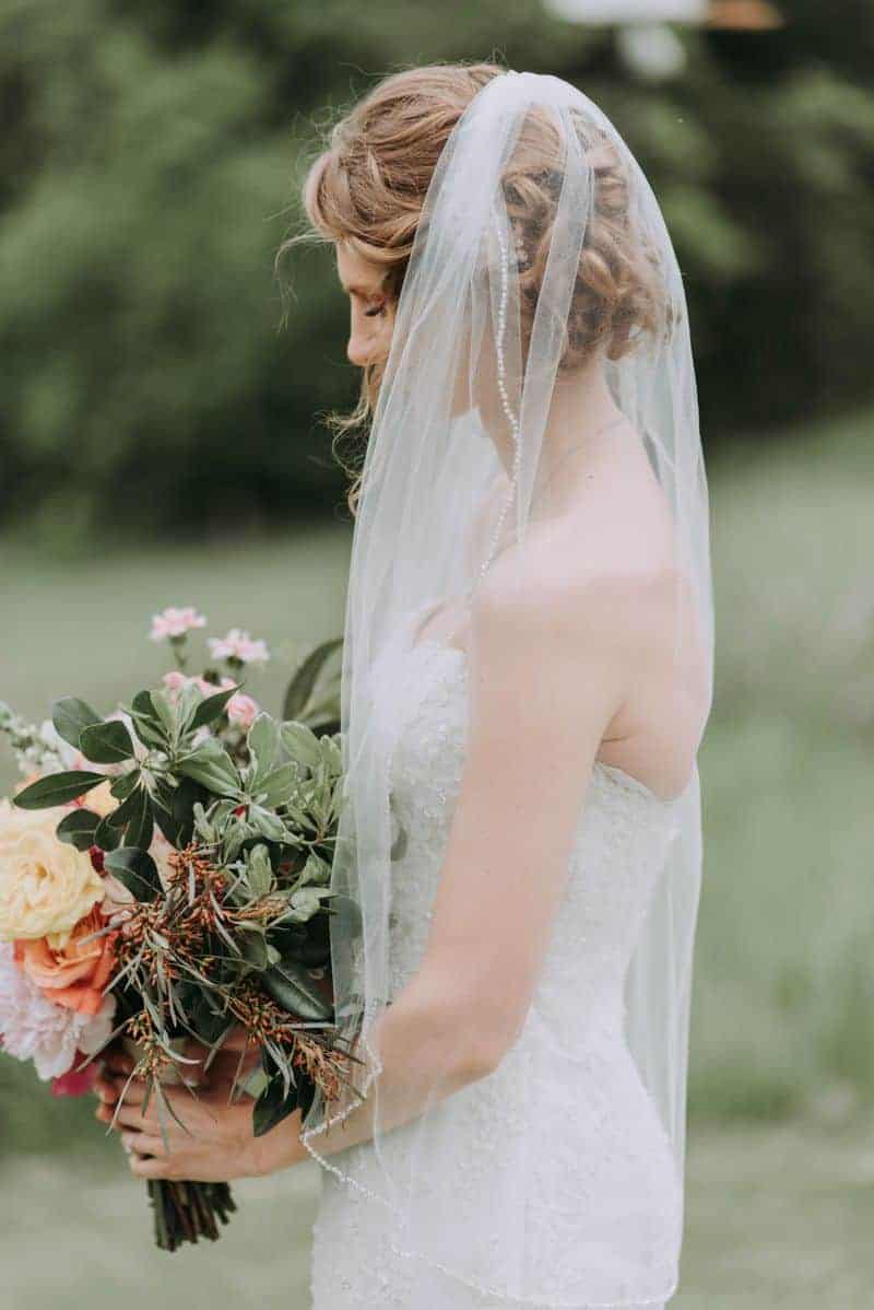 A bride in a beautiful thrifted wedding dress