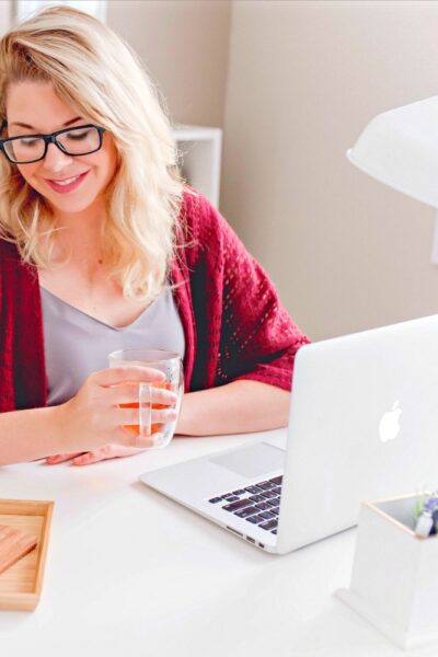 A woman reviewing her Restored 316 blog theme.