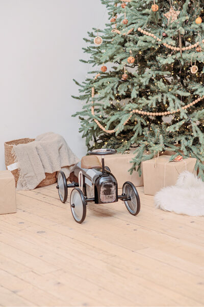 A cute christmas on a budget gift under a minimalist Christmas tree