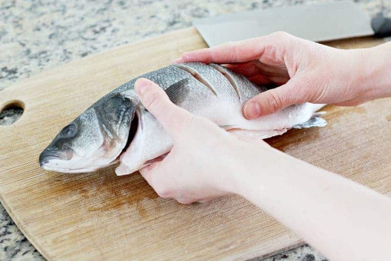 Cutting a Chinese fish for Chinese New Year