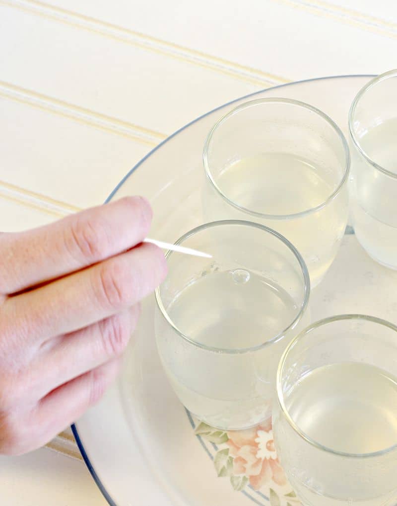 Poking bubbles in fruit jelly