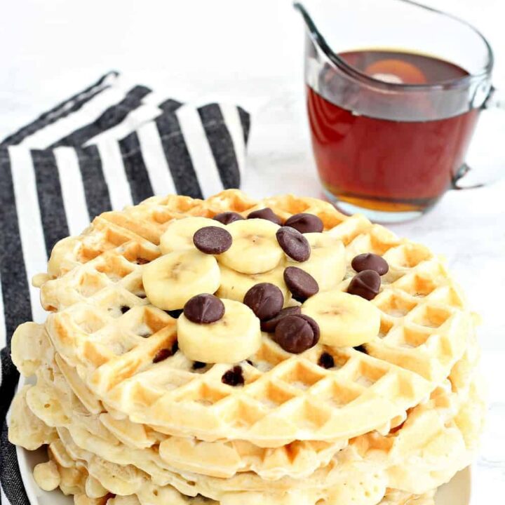 Chocolate chip waffles topped with chocolate chips and bananas