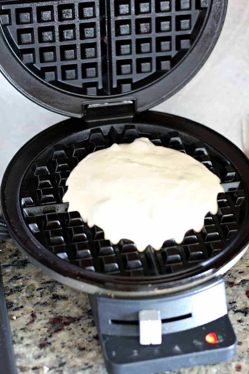 Chocolate chip waffle batter in waffle iron