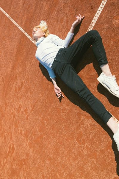 A female blogger laying down, frustrated with blogging