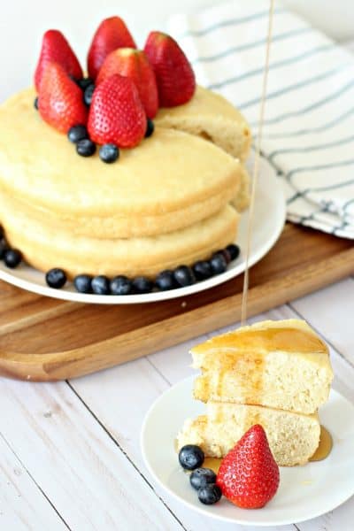 Two giant rice cooker pancakes stacked with fruit