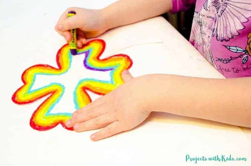 A child drawing a shamrock