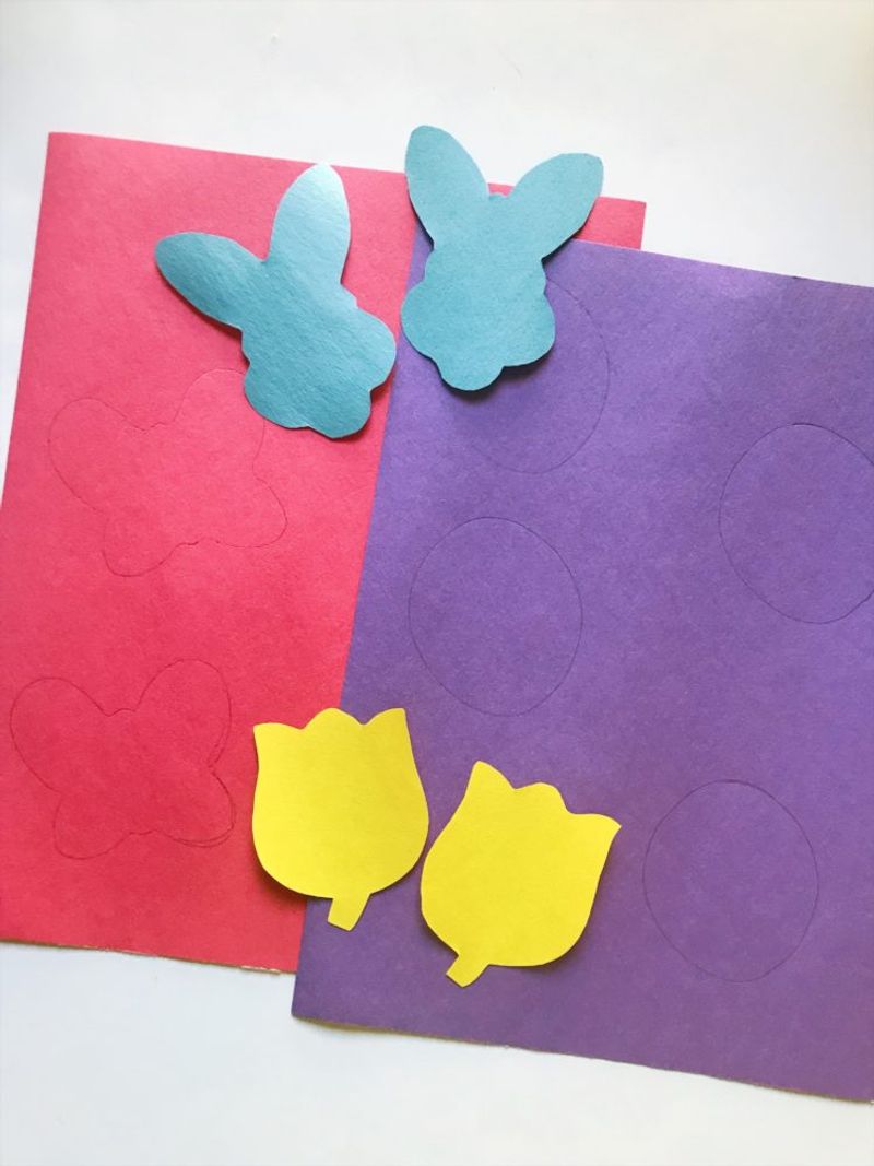 Paper cutouts of bunny and flowers for Easter game
