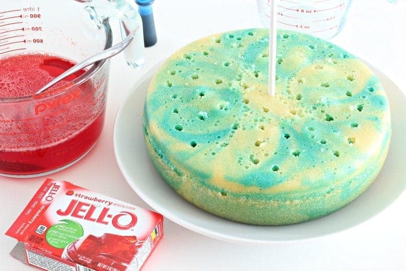 Poking holes in jello poke cake