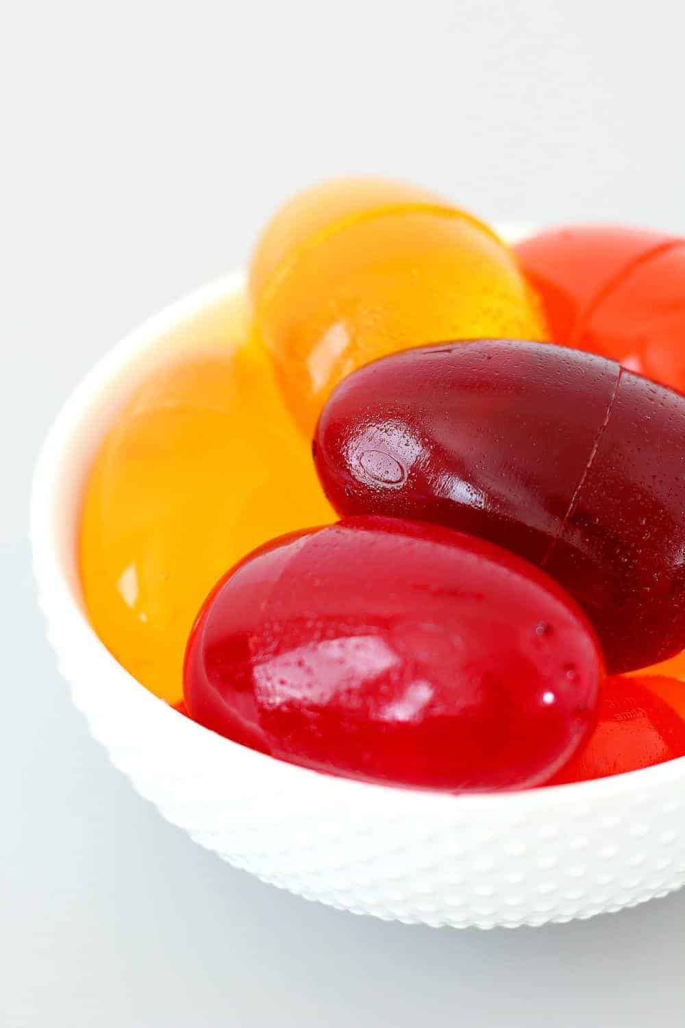 A white bowl full of Jello eggs