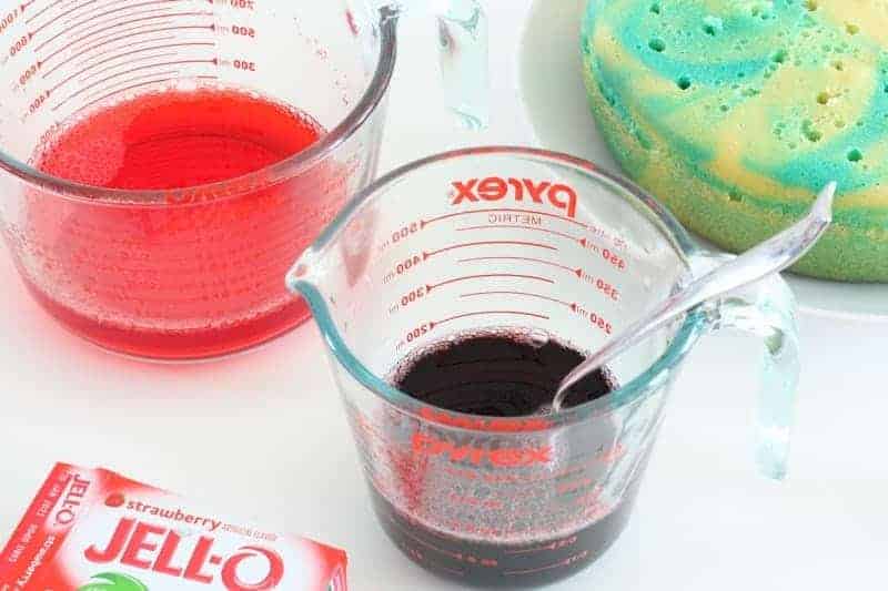 Preparing unicorn cake colors in cups