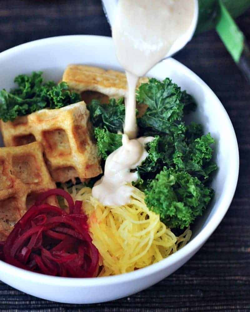 A bowl full of veggies and waffled tofu