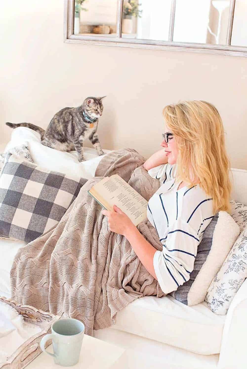 A lifestyle blogger at home with her cat