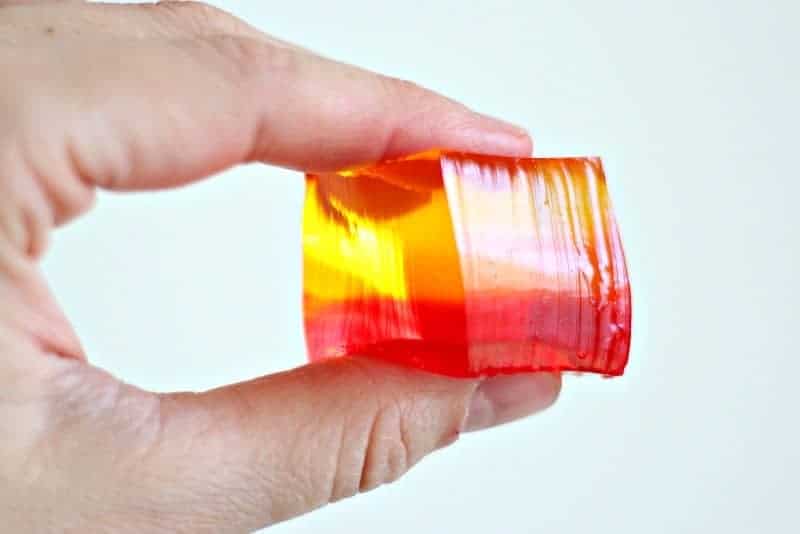 A hand holding finger jello