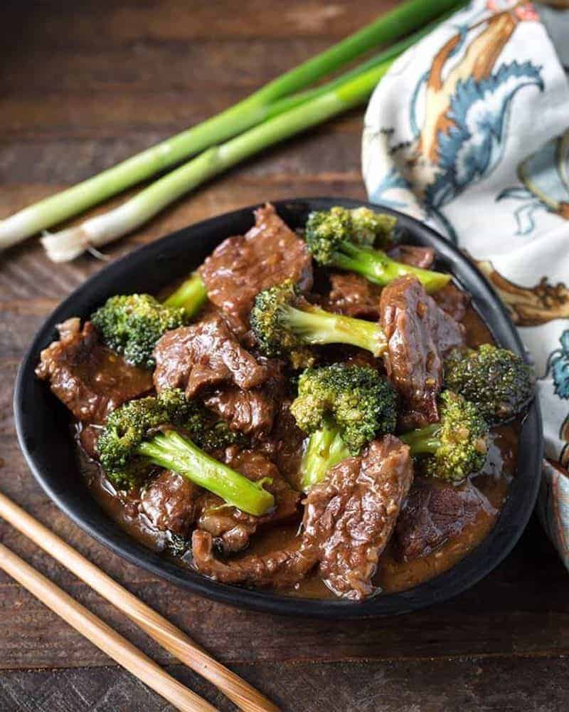 Instant pot beef and broccoli in a black bowl