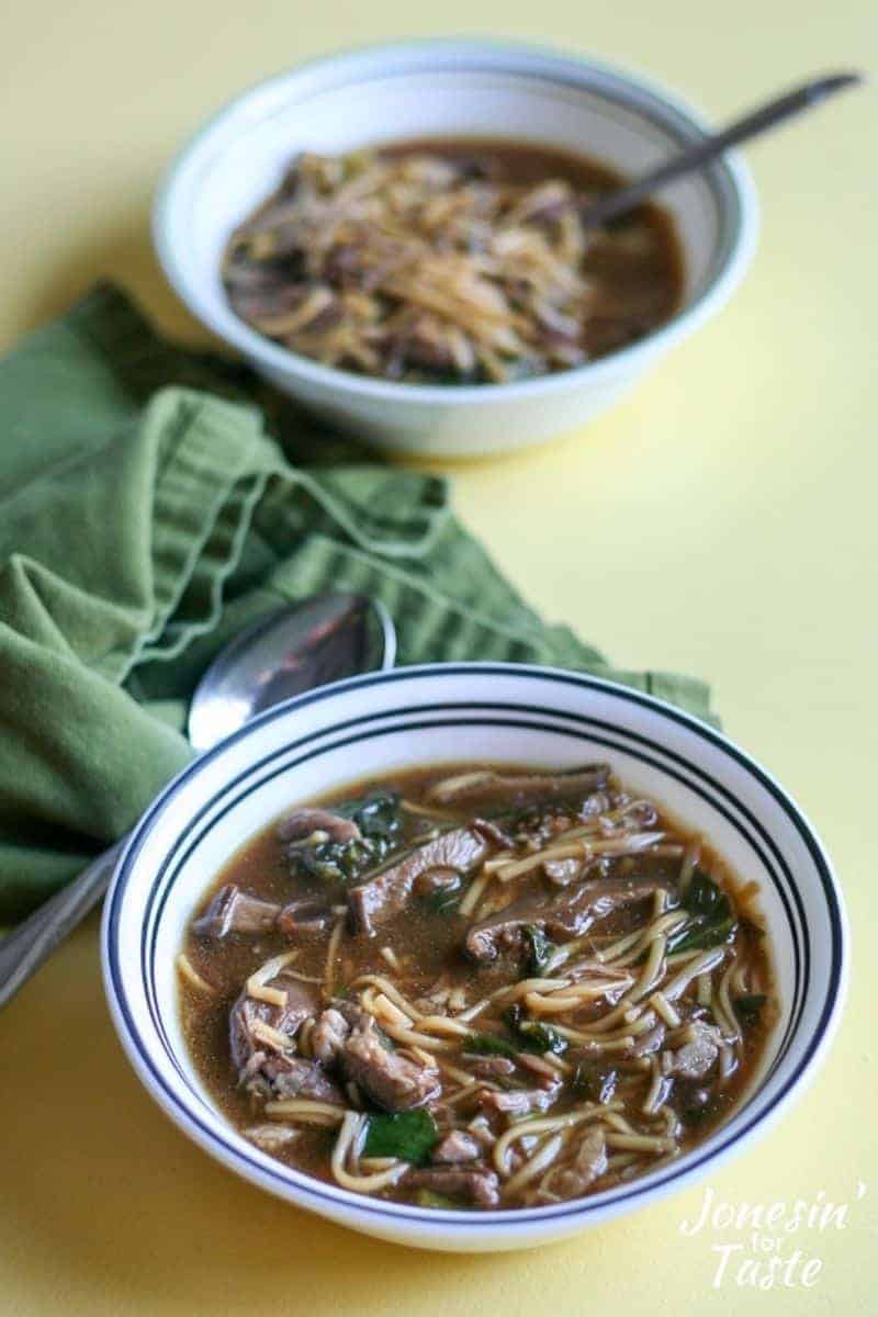 Two bowls of Instant Pot pork soup on a table