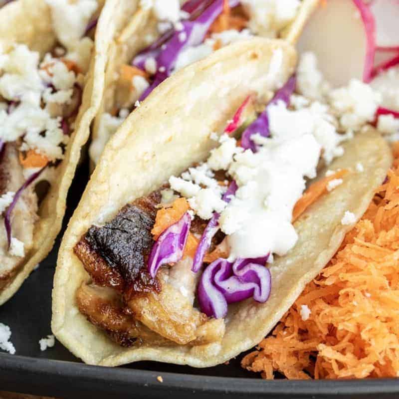 Close up of pork belly tacos