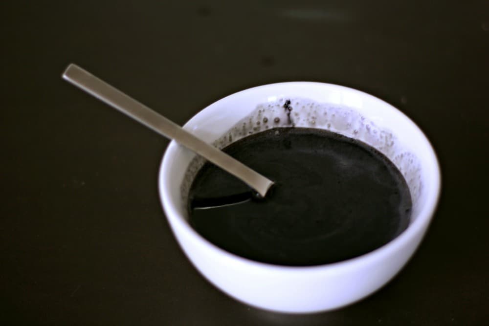 Close up of how to make black food coloring