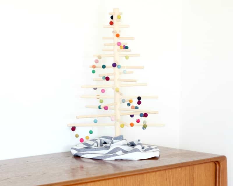 A felt ball garland on a minimalist Christmas tree