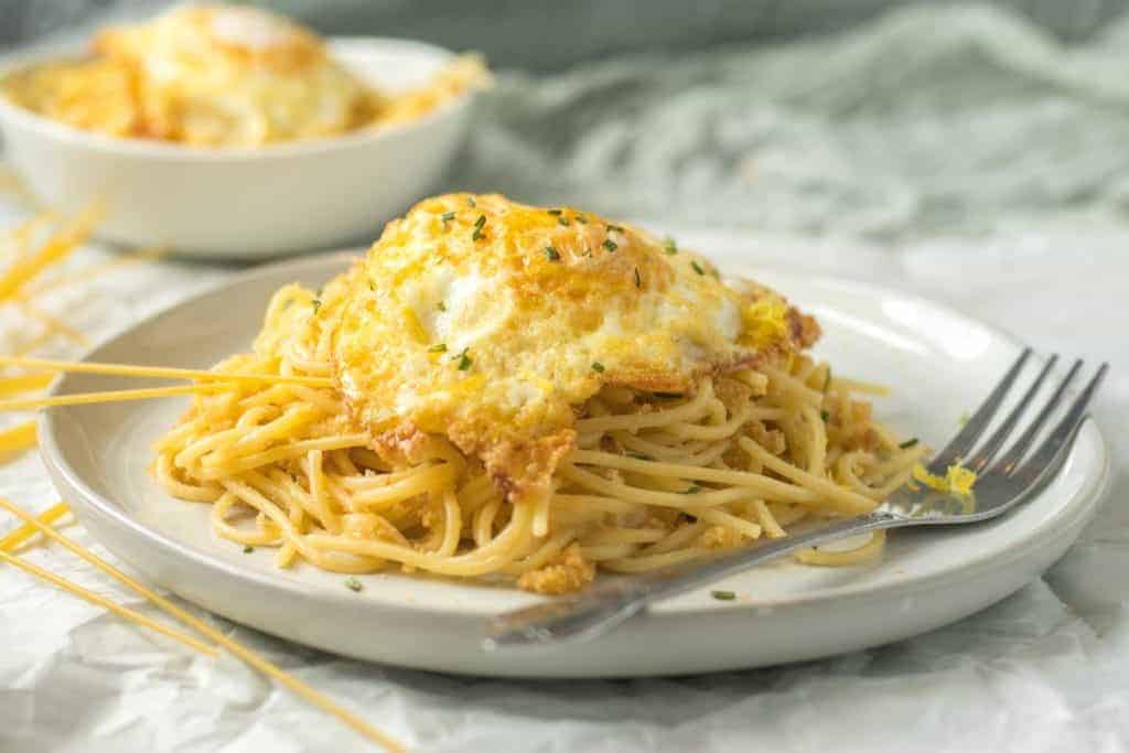 A Panko-fried egg over pasta