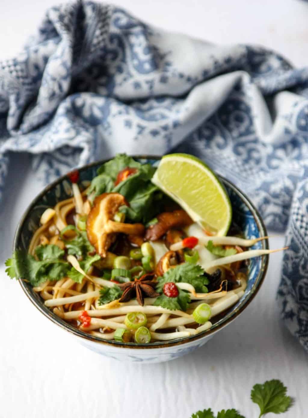 A bowl of vegan pho on a table