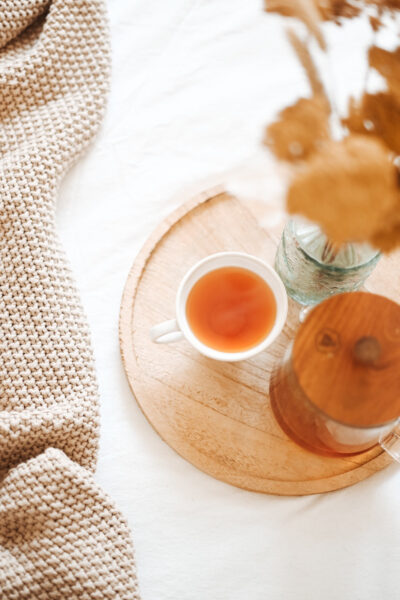 A wooden tray with tea for a daily be intentional practice