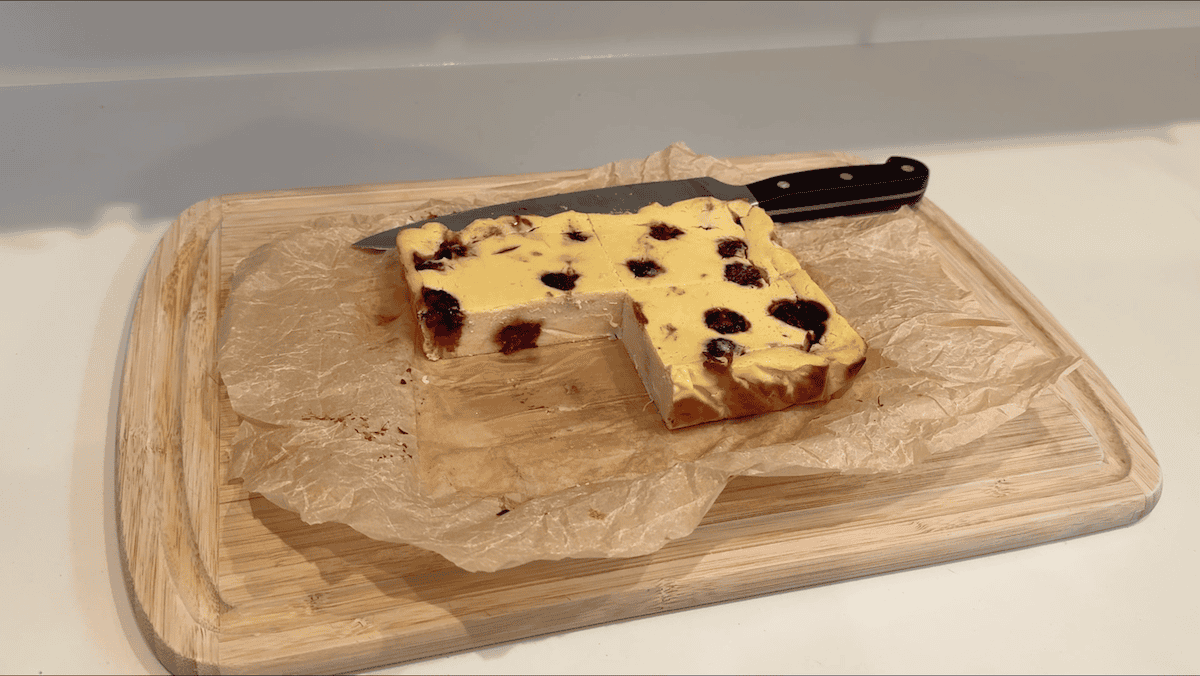 Protein cheesecake made with Greek yogurt on a wood cutting board